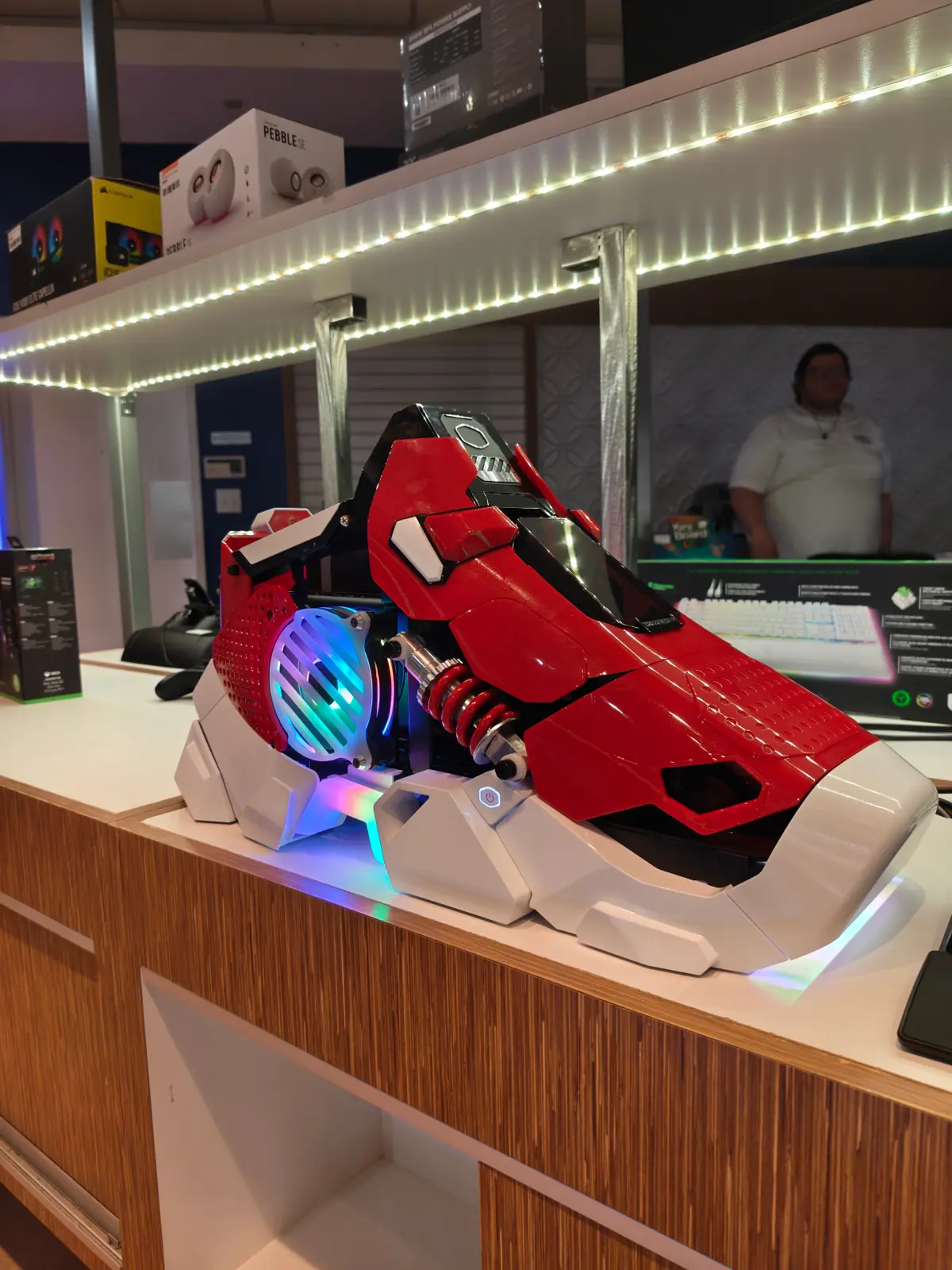 Custom red gaming PC case at Aura Tech